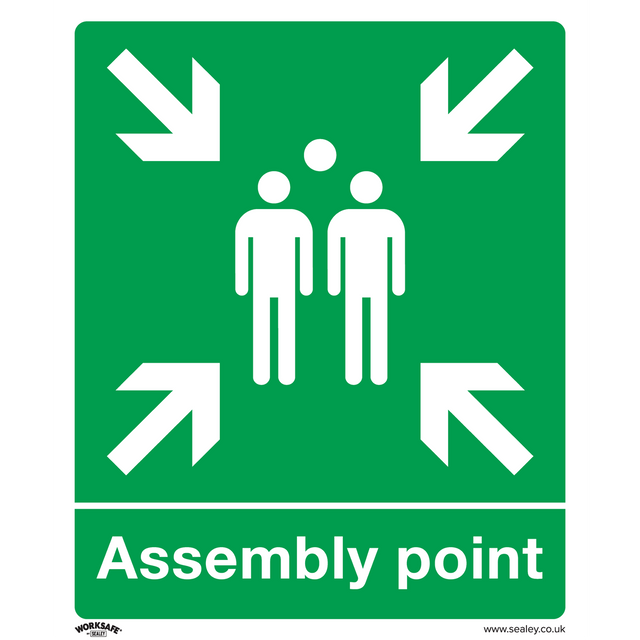 Sealey's Safe Conditions Safety Sign - Assembly Point (SS37P1) is made of rigid plastic and features white arrows pointing inward at three standing figures in the center, designating a gathering area. This green sign is ideal for commercial environments such as offices.