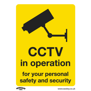 The Sealey Warning Safety Sign, model SS40V10, features a yellow background with a black camera icon and the message "CCTV in operation for your personal safety and security." Suitable for commercial environments, this sign is made from self-adhesive vinyl and includes www.sealey.co.uk at the bottom. It comes in a pack of 10.