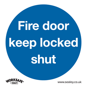 The Sealey Mandatory Safety Sign - Fire Door Keep Locked Shut - SS4P1 is a blue circular sign with white text that says, "Fire door keep locked shut." It is ideal for commercial environments and offices and is made of rigid plastic. The Sealey Worksafe logo and website, www.sealey.co.uk, are displayed at the bottom.