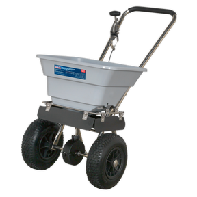 The Sealey Stainless Steel Broadcast Salt Spreader 37kg Walk Behind - SSB37W features a corrosion-resistant design with a gray hopper and black handle, ideal for distributing lawn treatments evenly over large areas. Equipped with pneumatic tires, this tool ensures easy maneuverability.