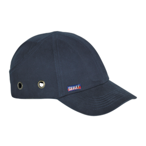 A Safety Baseball Bump Cap - SSP16 by Sealey in navy blue, featuring internal padding, metal eyelets on the side, a short peak design, and a small Sealey logo tag.