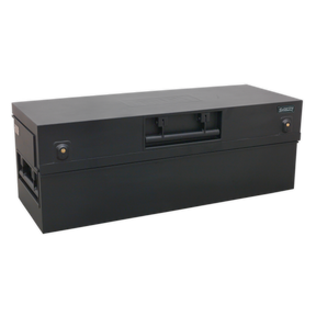 The Sealey Truck Box 1275 x 470 x 450mm - STB07 is a black rectangular heavy-duty storage box featuring a central handle, two side latches, and a nameplate on the top, making it ideal for secure tool storage.