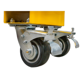 Close-up of two Ø125mm Sealey castor wheels from the Castor Wheel Kit for SSB02E & STB03E - STBWK, attached to a yellow metal structure. The left wheel features a brake lever labeled "OFF".
