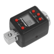 The black digital torque adaptor by Sealey, featuring red buttons and an LCD display showcasing "100." The device is labeled "Sealey" and includes a metal square drive at the bottom for precise torque levels. The product is officially named Torque Adaptor Digital 3/4"Sq Drive 200-1000Nm(147.5-738.5lb.ft) - STW292.