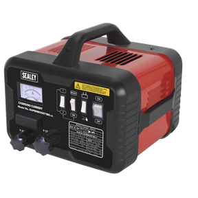 The Sealey Starter/Charger 180/40A 12/24V 230V - SUPERBOOST180, featuring a red and black design, comes with a carrying handle, control switches, an analog meter, and various labels on the front panel that offers a versatile 12/24V output for charging.