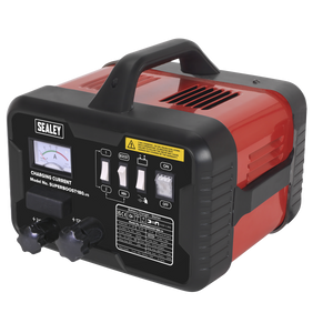 The Sealey Starter/Charger 180/40A 12/24V 230V - SUPERBOOST180, featuring a red and black design, comes with a carrying handle, control switches, an analog meter, and various labels on the front panel that offers a versatile 12/24V output for charging.