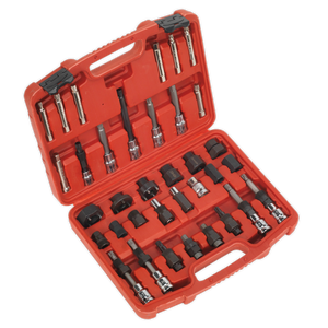 A red plastic tool case is open, displaying a variety of socket wrenches and extensions neatly organized in molded compartments. Nestled among them is the Sealey Alternator Freewheel Pulley Removal Set 35pc - SX404, a specialized tool for servicing a freewheel alternator pulley.