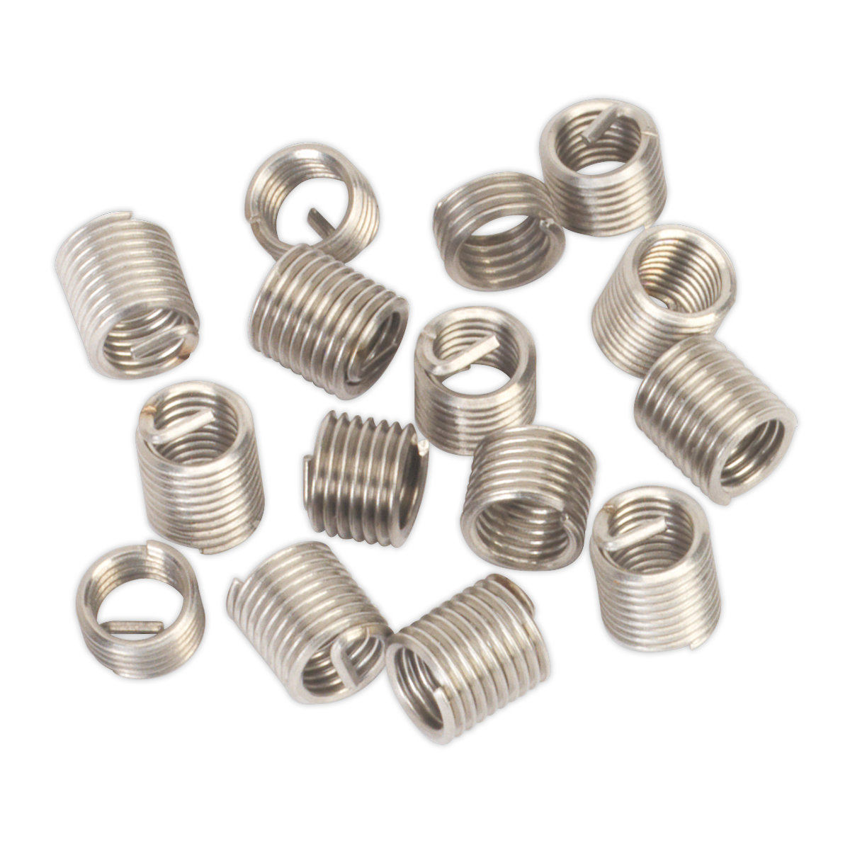 Several Sealey Thread Inserts M6 x 1mm for TRM6 - TRM6R are scattered on a white surface.