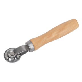 The Patch Stitch Roller - TST15 by Sealey features a wooden handle and a metal circular blade, perfect for ensuring smooth slices every time.