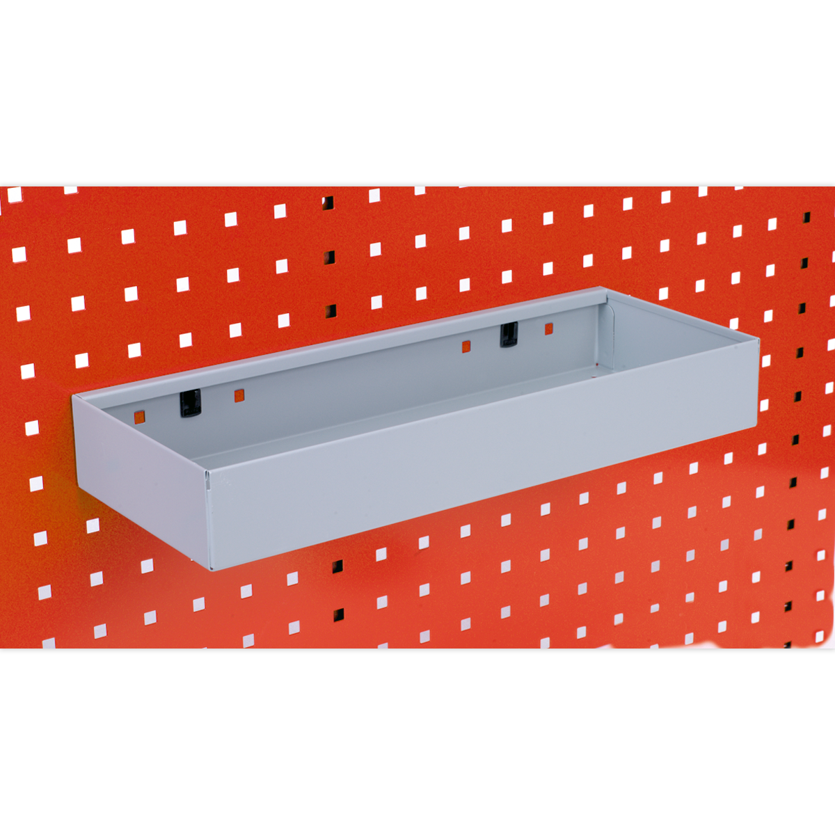 A Sealey Storage Tray for PerfoTool/Wall Panels (450 x 175 x 65mm) - TTS41 is attached to a red perforated PerfoWall panel, seamlessly integrating with the board’s design and enhancing your tool accessories storage.