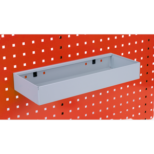 A Sealey Storage Tray for PerfoTool/Wall Panels (450 x 175 x 65mm) - TTS41 is attached to a red perforated PerfoWall panel, seamlessly integrating with the board’s design and enhancing your tool accessories storage.