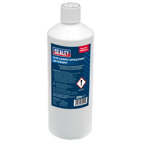 A white plastic bottle labeled "Sealey Carpet/Upholstery Detergent 1L - VMR921S" with safety warnings, showcasing the non-corrosive cleaning power of Sealey products.