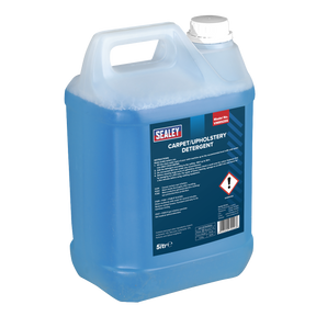 A 5-liter blue plastic container of Sealey Carpet/Upholstery Detergent, model VMR925S, featuring a white cap and highlighting its non-corrosive cleaning power. The label displays product information and safety warnings, maintaining the high standards expected from Sealey quality cleaning products.