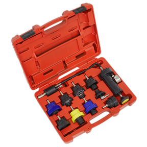 The Sealey Cooling System Pressure Test Kit 10pc - VS0013 comes in an open red plastic case, featuring various automotive tools and connectors, including vehicle-specific cap adapters and a pressure gauge, all neatly organized in molded compartments.