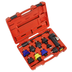 The Sealey Cooling System Pressure Test Kit 10pc - VS0013 comes in an open red plastic case, featuring various automotive tools and connectors, including vehicle-specific cap adapters and a pressure gauge, all neatly organized in molded compartments.