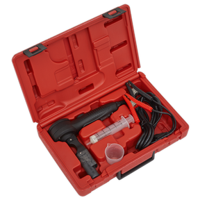 The Sealey Brake Fluid Tester - Boil Test - VS0275 includes a red plastic case, a handheld device, a syringe, two cables with clamps, and a small plastic cup to measure water content.