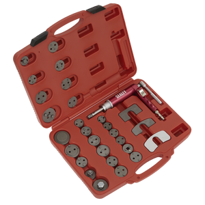 The Sealey Air Operated Brake Piston Wind-Back Tool Kit 29pc (VS0286) comes in a red plastic case that includes an assortment of metal fittings, connectors, and a tool handle designed specifically for brake pistons. Each piece has its own slot, ensuring that this master set of adaptors and the air-operated wind-back tool remains neatly organized inside.