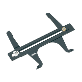 A Sealey Brake Drum Wear Gauge - VS040 in black, featuring two adjustable legs and a sliding scale for precision measurements with both Imperial and Metric scales.