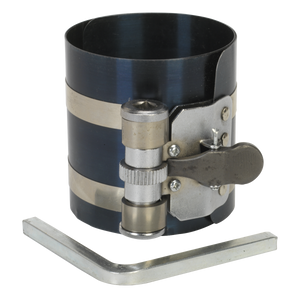 A Sealey Piston Ring Compressor 75mm Ø60-175mm - VS156 with a ratchet action tension mechanism sits beside an L-shaped Allen wrench.