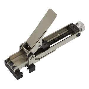 The Spring Hose Clip Tensioner Tool - VS1575 by Sealey is a metal lever-action tool with a clamping mechanism and serrated gripping edges, designed for single-handed use in confined areas, making it ideal for securing or manipulating objects.