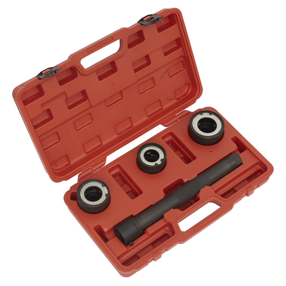 The Sealey Steering Rack Knuckle Tool Set 4pc - VS4003 is an open red plastic case containing four automotive tools, including three metal rings and a cylindrical tool with black handles, all set in custom cutouts inside the case, specifically designed for work on a steering knuckle.