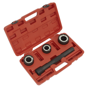 The Sealey Steering Rack Knuckle Tool Set 4pc - VS4003 is an open red plastic case containing four automotive tools, including three metal rings and a cylindrical tool with black handles, all set in custom cutouts inside the case, specifically designed for work on a steering knuckle.