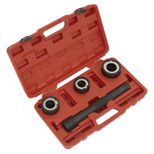 The Sealey Steering Rack Knuckle Tool Set 4pc - VS4003 is an open red plastic case containing four automotive tools, including three metal rings and a cylindrical tool with black handles, all set in custom cutouts inside the case, specifically designed for work on a steering knuckle.