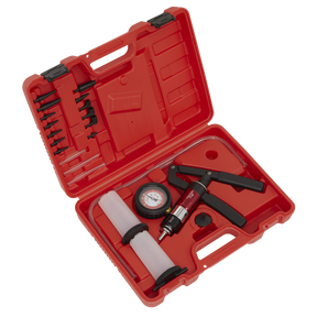 The Sealey VS403 Vacuum & Pressure Test/Bleeding Kit comes in a red plastic case, containing a black and red vacuum pump, pressure gauge, hoses, and various small attachments. The case is open with the contents neatly arranged. This versatile kit serves as both a brake and clutch bleeding tool and a vacuum pressure diagnostic tool for detecting vehicle system faults.