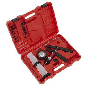 The Sealey VS403 Vacuum & Pressure Test/Bleeding Kit comes in a red plastic case, containing a black and red vacuum pump, pressure gauge, hoses, and various small attachments. The case is open with the contents neatly arranged. This versatile kit serves as both a brake and clutch bleeding tool and a vacuum pressure diagnostic tool for detecting vehicle system faults.