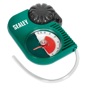 The Sealey Propylene Glycol Antifreeze Tester Twin-Rotor - VS4121 features a green and black design with a transparent viewing window that displays a red and green gauge. It includes a flexible hose at the bottom and has "Sealey" printed on the top left. This tester is ideal for checking freeze protection levels when using propylene glycol antifreeze.