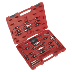 The Diesel Fuel Priming Set - VS555 by Sealey is presented in a red plastic case containing various automotive pressure test adapters, quick connectors, and the fuel priming set itself. All components are arranged neatly in custom slots for organization and protection. The open case displays the tools inside.
