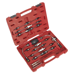 The Diesel Fuel Priming Set - VS555 by Sealey is presented in a red plastic case containing various automotive pressure test adapters, quick connectors, and the fuel priming set itself. All components are arranged neatly in custom slots for organization and protection. The open case displays the tools inside.