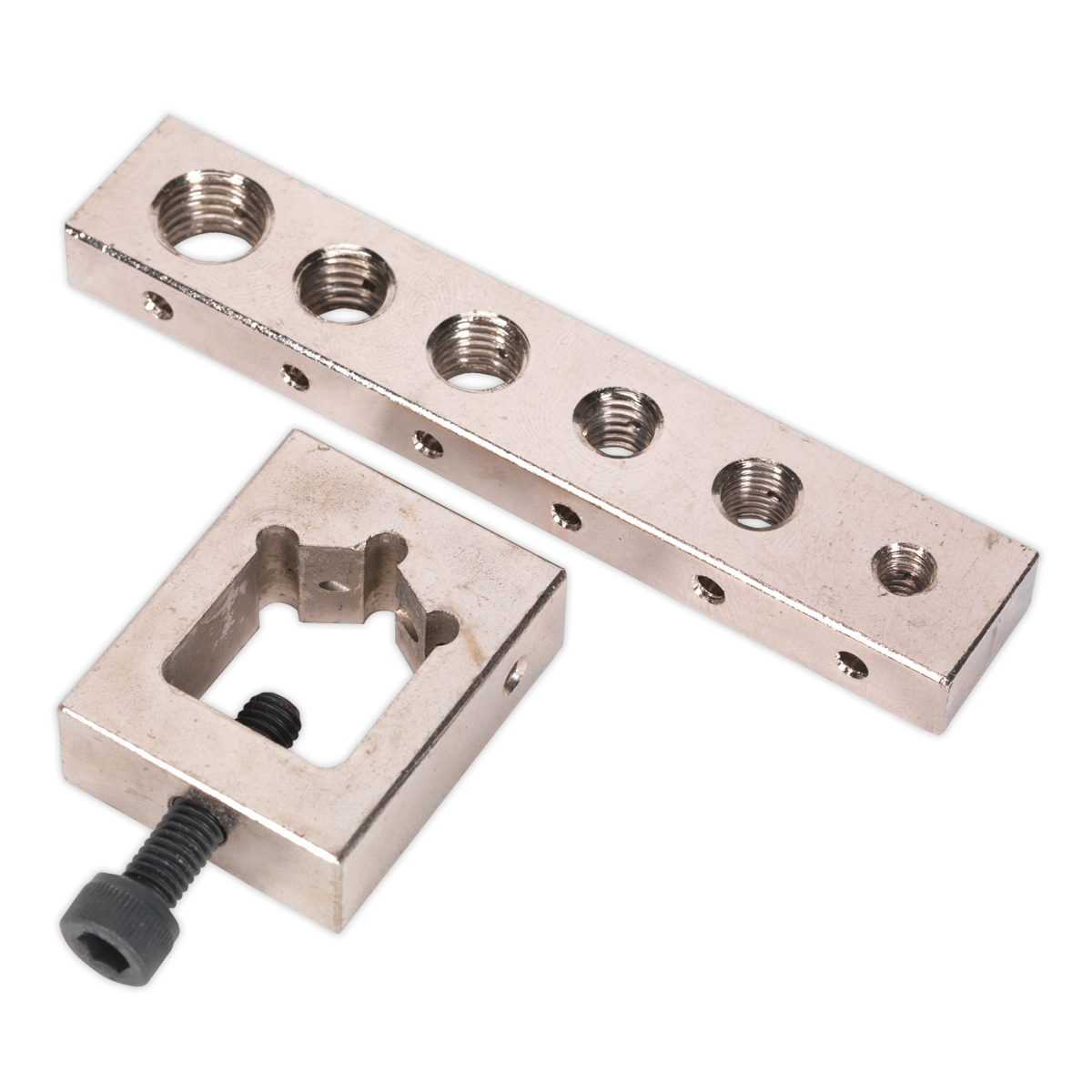 The Sealey Nut/Bolt Drill Jig - VS559 is a compact metallic block featuring multiple threaded holes and a square-shaped clamp with an attached screw, making it ideal for accurate drilling.