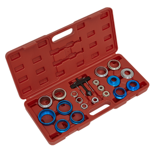 The Sealey Oil Seal Removal/Installation Kit - VS7002 includes a variety of metal bearings, spacers, and a comprehensive oil seal tool, all housed in a red carrying case with a handle for easy transport.