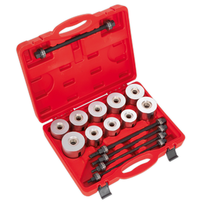 The Sealey Bearing & Bush Removal/Installation Kit 27pc - VS7026 is a red plastic case that contains a set of metal cylindrical components and several black rods with threaded ends, all organized in fitted compartments. It is specifically designed for the removal and installation of suspension bushes.