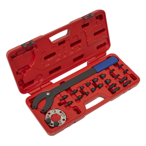 A red plastic case containing the Sealey Pulley Holding/Turning Set 24pc - VAG - VS754, which includes an adjustable spanner wrench, various fittings organized in designated slots, and a water pump tool for comprehensive engine maintenance.