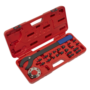 A red plastic case containing the Sealey Pulley Holding/Turning Set 24pc - VAG - VS754, which includes an adjustable spanner wrench, various fittings organized in designated slots, and a water pump tool for comprehensive engine maintenance.