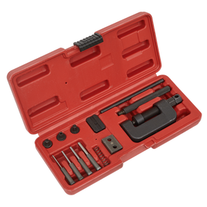 The Sealey Motorcycle Chain Breaker & Riveter - VS779 is a red plastic case containing various metal tools, including a breaker bar, pins, a chain breaker tool, and small components.