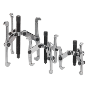 The Sealey Triple Leg Gear Reversible Puller Set 3pc (VS77) is displayed, featuring three metal gear pullers of varying sizes. Each puller is equipped with three adjustable arms, a threaded center screw for extracting gears, and hex head forcing screws. They are crafted from drop-forged carbon steel and are heat-treated with a chrome-plated finish for durability.