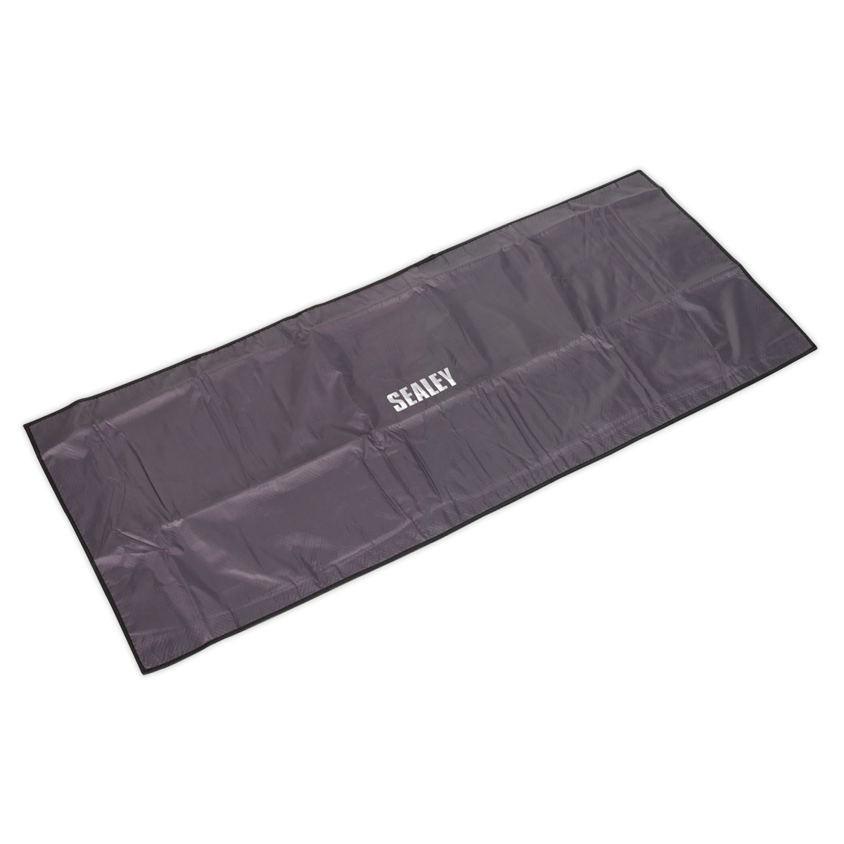 A rectangular, black Sealey-branded Wing/Grille Cover Non-Slip 1200 x 500mm - VS8502, made from water-resistant nylon with a non-slip foam lining, neatly folded and positioned against a white background.