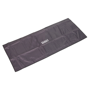 A rectangular, black Sealey-branded Wing/Grille Cover Non-Slip 1200 x 500mm - VS8502, made from water-resistant nylon with a non-slip foam lining, neatly folded and positioned against a white background.