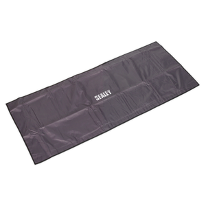 A rectangular, black Sealey-branded Wing/Grille Cover Non-Slip 1200 x 500mm - VS8502, made from water-resistant nylon with a non-slip foam lining, neatly folded and positioned against a white background.