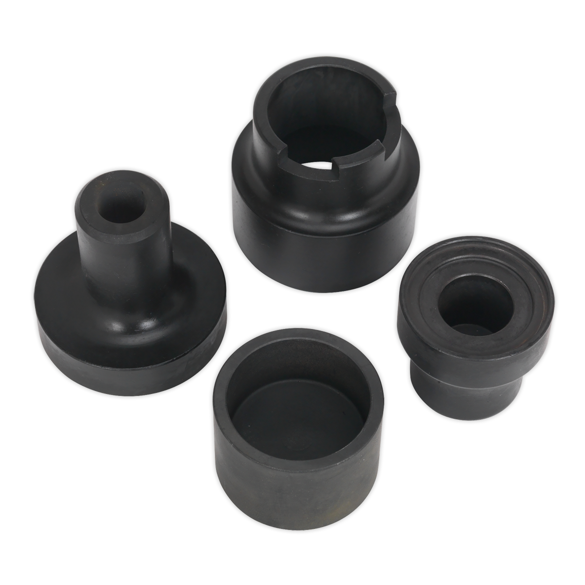 The Bush Removal Adaptor Set - Renault Laguna - VSE127H02 by Sealey includes four black components of different shapes and sizes, symmetrically arranged, resembling tools used for front ball joint removal on a Renault Laguna.