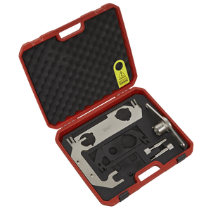 The Timing Tool Kit for JLR 2.0/2.0D Ingenium Engine - Chain Drive - VSE3037 by Sealey is a red plastic storage case with instructions, containing metal tools and parts, including camshaft adjuster tools, all organized in foam padding.