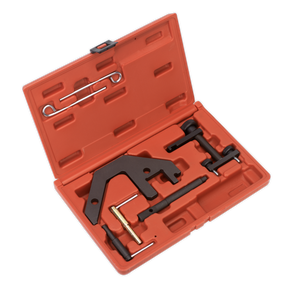 The Sealey Diesel Engine Timing Tool Kit (VSE5666), designed for BMW M47/M57, Land Rover TD4/TD6, MG 2.0D, and GM 2.5D chain drive engines, comes in a red plastic case containing an assortment of black and metallic tools. Included are a flat, angular tool along with various rods and pins neatly arranged in molded slots; this kit also features specialized flywheel locking tools tailored for these specific diesel engines.