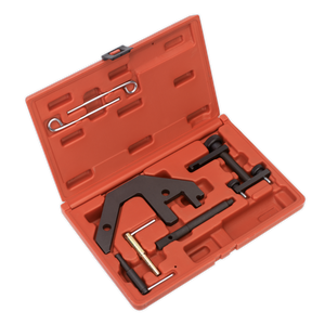 The Sealey Diesel Engine Timing Tool Kit (VSE5666), designed for BMW M47/M57, Land Rover TD4/TD6, MG 2.0D, and GM 2.5D chain drive engines, comes in a red plastic case containing an assortment of black and metallic tools. Included are a flat, angular tool along with various rods and pins neatly arranged in molded slots; this kit also features specialized flywheel locking tools tailored for these specific diesel engines.