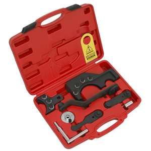 The Sealey Diesel Engine Timing Tool Kit (VSE6146) for VW 2.5D TDi PD gear drive diesel engines features a red plastic carrying case that holds an assortment of black and metallic automotive tools, including wrenches, sockets, and clamps, all neatly arranged in molded slots—ideal for maintenance tasks.