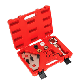 A Sealey Petrol Engine Timing Tool Kit - VAG 1.8/2.0 - Chain Drive (VSE6236) in a red plastic case, containing a multimeter kit with various components such as connectors, probes, and adapters—all neatly organized in designated compartments—ideal for servicing VAG group petrol engines.