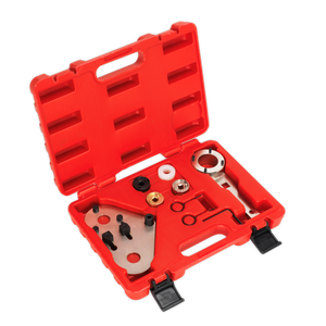 A Sealey Petrol Engine Timing Tool Kit - VAG 1.8/2.0 - Chain Drive (VSE6236) in a red plastic case, containing a multimeter kit with various components such as connectors, probes, and adapters—all neatly organized in designated compartments—ideal for servicing VAG group petrol engines.