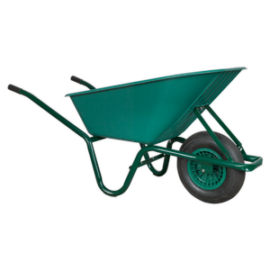 The Sealey Wheelbarrow 85L - WB85 is a green wheelbarrow with a single wheel and black handles, featuring a durable tubular steel frame for transporting materials in construction or gardening.